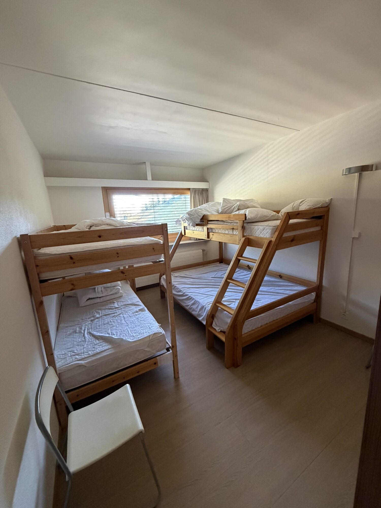 Bedroom of Rosablanche C34 with two bunk beds, sleeps up to 5, Siviez